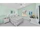 Bright bedroom boasts vaulted ceiling, ceiling fan, and serene view at 1706 Moreno Pl, The Villages, FL 32159