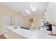 Well-lit kitchen featuring a breakfast bar and a skylight for natural light at 1706 Moreno Pl, The Villages, FL 32159