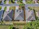 Aerial view of a home and neighborhood with mature trees and landscaping at 1741 Pennecamp Dr, The Villages, FL 32162