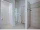 Spacious bathroom featuring tile floors and a tiled shower at 1741 Pennecamp Dr, The Villages, FL 32162
