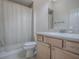 Bathroom with vanity and tile floor near the shower-tub combo at 1741 Pennecamp Dr, The Villages, FL 32162