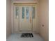 Elegant front door with decorative glass and side lites at 1741 Pennecamp Dr, The Villages, FL 32162