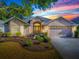 Charming home featuring manicured lawn, mature trees, neutral paint, and an attached two car garage at 1741 Pennecamp Dr, The Villages, FL 32162