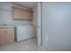 Laundry room featuring modern appliances and ample storage at 1741 Pennecamp Dr, The Villages, FL 32162