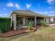A covered patio with outdoor plants and screens to keep out the bugs at 1741 Pennecamp Dr, The Villages, FL 32162
