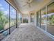 Spacious screened-in patio with views of the lush landscaping and outdoor space at 1741 Pennecamp Dr, The Villages, FL 32162