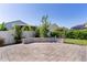 Backyard showing the beautiful stone patio and landscaping perfect for outdoor entertaining at 1796 Zientara Loop, The Villages, FL 32163