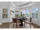Staged breakfast nook with table, chairs, decor, and natural lighting at 1796 Zientara Loop, The Villages, FL 32163
