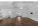 Open living area features modern flooring, decorative ceilings with fan and seamless flow to other rooms at 1796 Zientara Loop, The Villages, FL 32163