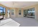 Covered patio with access to the outdoors, with windows and a ceiling fan at 1796 Zientara Loop, The Villages, FL 32163