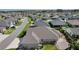 Home featuring backyard landscaping and a view of the surrounding neighborhood at 1796 Zientara Loop, The Villages, FL 32163