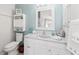 Comfortable bathroom featuring a white vanity and ocean-themed decor at 1814 Marquez Loop, The Villages, FL 32159