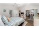 Bright and airy bedroom with access to an enclosed patio and ensuite bathroom at 1814 Marquez Loop, The Villages, FL 32159