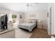 Bright bedroom with a ceiling fan and coastal decor accents at 1814 Marquez Loop, The Villages, FL 32159