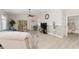 Spacious living room with access to a bathroom and patio, featuring modern decor at 1814 Marquez Loop, The Villages, FL 32159