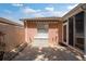 A narrow outdoor patio with storage box and a window with awning at 1814 Marquez Loop, The Villages, FL 32159