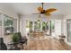 Comfortable enclosed patio with stylish furnishings and view of the yard at 1814 Marquez Loop, The Villages, FL 32159