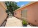 Private outdoor patio with sliding glass doors with tile and a potted fern at 1814 Marquez Loop, The Villages, FL 32159