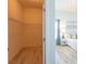 Walk-in closet with ample shelving and access to a bright, airy bedroom at 1954 Ladyfish Ave, The Villages, FL 32162