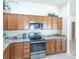 Charming kitchen featuring granite countertops and stainless steel appliances, perfect for culinary enthusiasts at 1954 Ladyfish Ave, The Villages, FL 32162
