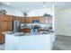 Modern kitchen with granite countertops, stainless appliances, and ample cabinet space at 1954 Ladyfish Ave, The Villages, FL 32162