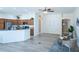 Open-concept living area with modern kitchen and dining space, perfect for entertaining at 1954 Ladyfish Ave, The Villages, FL 32162