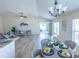 Bright living area connects the kitchen and dining space, offering seamless flow and style at 1954 Ladyfish Ave, The Villages, FL 32162