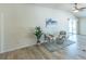 Comfortable living room with stylish décor and sliding glass doors to the lanai at 1954 Ladyfish Ave, The Villages, FL 32162