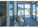 A cozy screened-in patio with views of the green backyard and nearby fence at 1954 Ladyfish Ave, The Villages, FL 32162