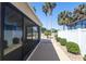 This screened in lanai features a paver patio, views of the green space, and is great for outdoor living at 1954 Ladyfish Ave, The Villages, FL 32162