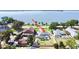 The aerial view reveals a spacious yard, screened pool, and peaceful waterfront setting of this beautiful home at 2037 Lakeshore Dr, Mount Dora, FL 32757
