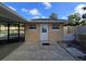 View of the backyard with access to the pool area and additional storage at 2037 Lakeshore Dr, Mount Dora, FL 32757