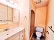 Bathroom with vanity, mirror, shower, and toilet at 2037 Lakeshore Dr, Mount Dora, FL 32757