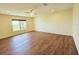 Bright bedroom featuring a ceiling fan, recessed lights, and wood-look flooring at 2037 Lakeshore Dr, Mount Dora, FL 32757