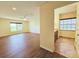 Bedroom with hardwood floors and a hallway view of an ensuite bathroom at 2037 Lakeshore Dr, Mount Dora, FL 32757