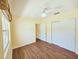 Bedroom featuring wood-look flooring, neutral paint, ceiling fan and large closet at 2037 Lakeshore Dr, Mount Dora, FL 32757