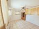 Bright bonus room with cabinets, tiled floors, and natural light from the exterior window at 2037 Lakeshore Dr, Mount Dora, FL 32757