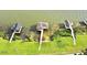 Waterfront property features three docks and lush greenery at 2037 Lakeshore Dr, Mount Dora, FL 32757