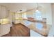 Spacious kitchen with white cabinets, countertops, and modern appliances at 2037 Lakeshore Dr, Mount Dora, FL 32757