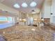 Well-lit kitchen features white cabinets, granite countertops, and appliances at 2037 Lakeshore Dr, Mount Dora, FL 32757