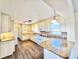 Bright kitchen with white cabinets, granite countertops, and a backsplash at 2037 Lakeshore Dr, Mount Dora, FL 32757