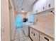 Laundry room with washer, dryer, cabinetry, and tile flooring at 2037 Lakeshore Dr, Mount Dora, FL 32757