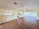 Open-concept living room with wood-look flooring and an airy feel at 2037 Lakeshore Dr, Mount Dora, FL 32757