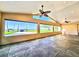 Spacious living room with large windows offering lake views and modern ceiling fans at 2037 Lakeshore Dr, Mount Dora, FL 32757