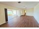 Spacious living room with hardwood floors and sliding glass doors to the patio at 2037 Lakeshore Dr, Mount Dora, FL 32757