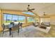 Bright open living space with views of the water, featuring a dining area and comfortable seating at 2037 Lakeshore Dr, Mount Dora, FL 32757