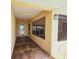 Enclosed patio with concrete floors, screens, and natural light at 2037 Lakeshore Dr, Mount Dora, FL 32757