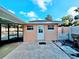Enclosed patio view shows access to the yard, white privacy fence, and access to the home at 2037 Lakeshore Dr, Mount Dora, FL 32757