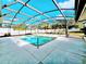 Screened-in pool boasts a large deck, bright natural light and ample space for entertaining at 2037 Lakeshore Dr, Mount Dora, FL 32757
