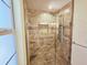 Modern walk-in shower with a glass door, body jets, and decorative tile at 2037 Lakeshore Dr, Mount Dora, FL 32757